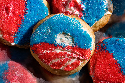 Sugar cookies with sprinkles in the shape of Barrack Obama's logo.