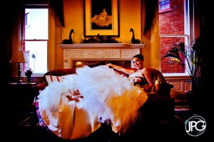 Bride posing on a couch.