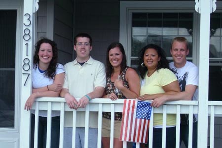 On the porch of the Emery's being patriotic.