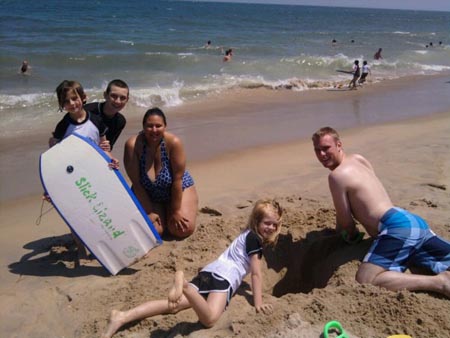 Playing with Katie Emery's nieces and nephew on the beach in Ocean City.