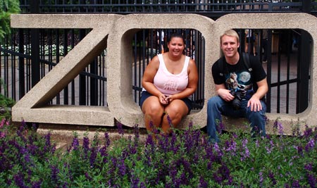 Kristina and Russell sitting in the DC zoo sign